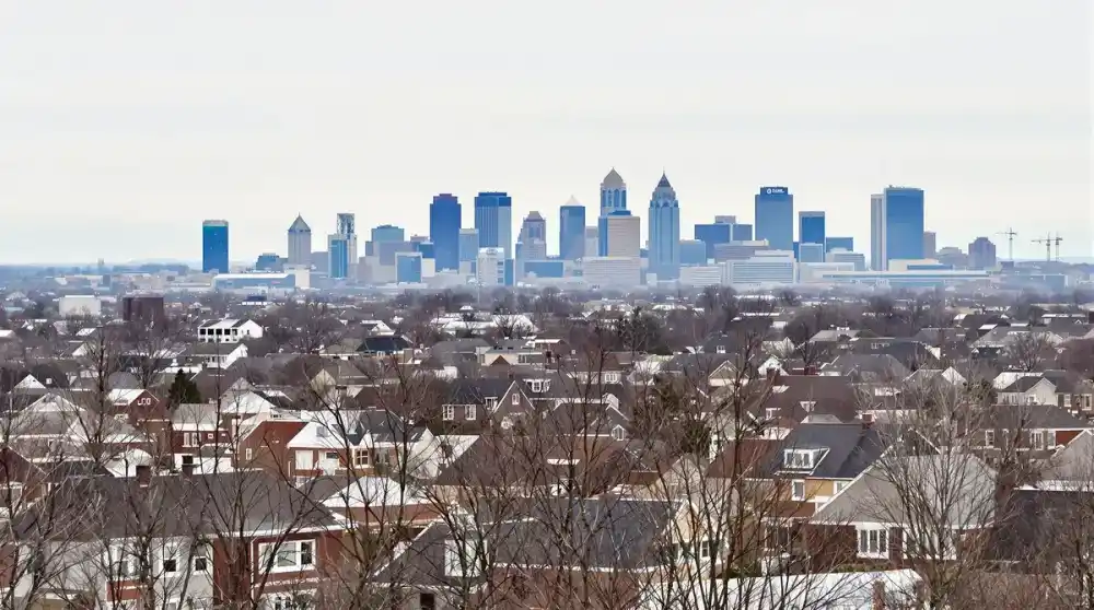 Kansas City skyline with residential neighborhoods in the foreground showing the typical 1940s-1960s housing stock that sits on Wymore-Ladoga clay soil with very high shrink-swell potential across Jackson and Johnson counties